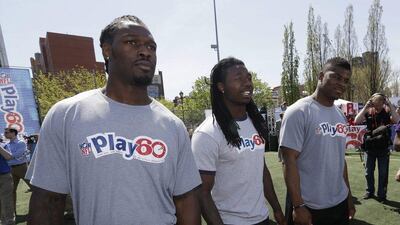 Jadeveon Clowney, left, Sammy Watkins, centre, and Khalil Mack participate in an NFL event in New York on Wednesday. Seth Wenig / AP / May 7, 2014