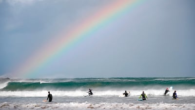 Surfers and bodyboarders at Towan Beach in Newquay, south-west England. AFP