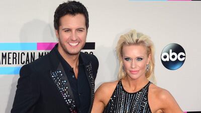 Country music singer Luke Bryan and Caroline Bryan arrive for the 2013 American Music Awards at the Nokia Theatre. Frederic J. Brown / AFP Photo