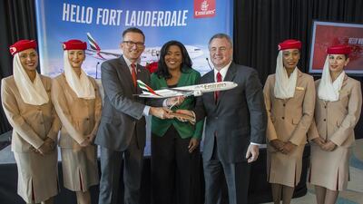 Hubert Frach, Emirates' divisional senior vice president of commercial operations for the western hemisphere, Barbara Sharief, Broward county mayor, and Mark Gale, Fort Lauderdale-Hollywood international airport chief, during the ceremonial gift exchange. Fla Jesus Aranguren / AP Images for Emirates