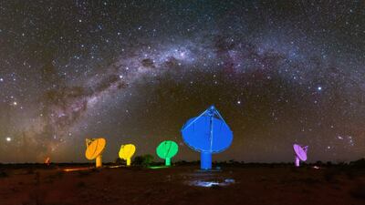 The Milky Way in the night sky above six of the Australian Square Kilometre Array Pathfinder's (ASKAP) antennas, which are illuminated with colours of the rainbow ahead of Mardi Gras 2019 at the Commonwealth Scientific and Industrial Research Organisation's (CSIRO) Murchison Radio-astronomy Observatory in remote Western Australia. EPA