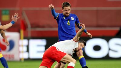 Robert Lewandowski under pressure from Andorra's Marc Rebes. EPA
