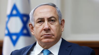 Israeli Prime Minister Benjamin Netanyahu chairs the weekly cabinet meeting at the Prime Minister's office in Jerusalem. He says he has been discussing with the United States the possibility of Israel annexing Jewish settlements in the occupied West Bank. Ronen Zvulun / Pool via AP