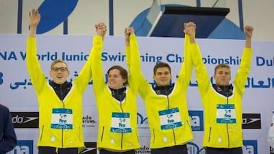 Australia celebrate winning the the boys 4x100m freestyle relay.