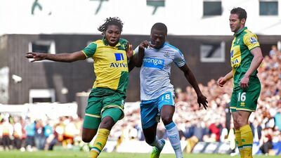 Norwich's Dieumerci Mbokani, left, and Newcastle's Chancel Mbemba vie for the ball as Matt Jarvis looks on. Norwich would later score the winning goal in injury time. Reuters / Alan Walter
