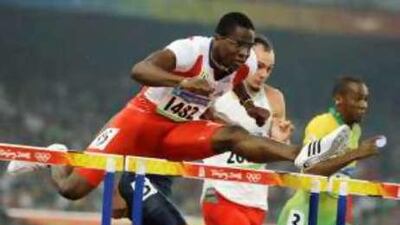 Cuba's Dayron Robles, the world record holder, finds his way to gold in the men's 100m hurdles.