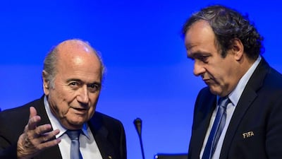 Michel Platini and Sepp Blatter shown at the Fifa Congress on Wednesday. Fabrice Coffrini / AFP / June 11, 2014