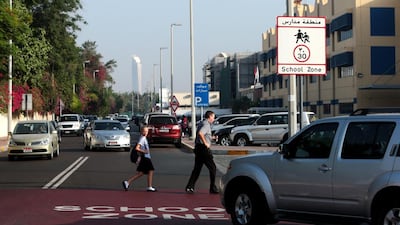 Motorists must observe the 30kph speed limit and yield the right of way to children at school crossings. Christopher Pike / The National