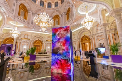 An interactive piece of art at the Misk Global Forum made from coloured dots that represent the answers to questions asked to participants. The final image will be made into an NFT. Misk Foundation