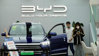 People visit a BYD showroom in Beijing. Electric car sales are rising steeply in China. AP