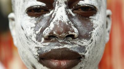 An Ivorian man with a painted face poses attends the Generation festival in Cocody village, Ivory Coast. The three century old festival honours the Ebrie people, members of the ethnic group Akan, who are best known for the large kingdom of Ashante, which evolved into what is now Ghana. The western most Akan peoples, the Agni, Baoul, and several smaller groups are descendants of people who fled from Ashante and now make up about one fifth of the Ivorian population. Each year the Ebrie gather to honour their ancestry. Legnan Koula / EPA