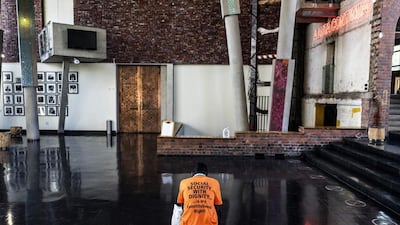 An activist from Black Sash, a South African human-rights NGO, waits for a ruling in the hall at the constitutional Court on March 17, 2017, in Johannesburg. The court is deliberating how to resolve the social grant payment crisis in the country, two weeks before the current deal expires. Marco Longari / Agence France-Presse