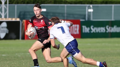 Players in action during the Gulf Under 19 boys cup semi-final 2 match between Dubai English Speaking College (black) vs Jumeirah English Speaking School (white and blue) held at The Sevens Stadium.