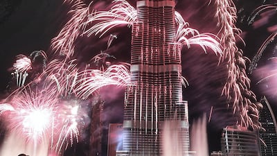 Fireworks explode from the Burj Khalifa, the world's tallest tower, in Dubai on January 1, 2014 to celebrate the new year. Dubai kicked off New Year with a dazzling bid for a new world record to cap those the Gulf city state already holds for its mammoth property developments. The glittering fireworks display that lasted around six minutes spanned over 100 kilometres (60 miles) of the Dubai coast, which boasts an archipelago of man-made islands and Burj Khalifa, the world's tallest tower. AFP PHOTO