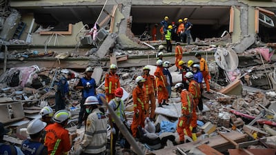 Rescuers work to find residents trapped under the rubble of the collapsed Sky Villa Condominium development in Mandalay, Myanmar. AFP