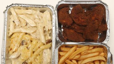 On the menu at Corniche Hospital: fried chicken wings, chips and pasta in a fatty cheese sauce. Delores Johnson / The National