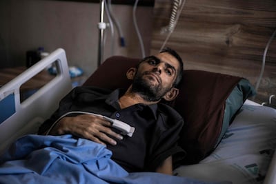 Palestinian journalist Mujahid Bani Mufleh receives treatment at Ibn Sina Hospital in Jenin, West Bank, after his release from an Israeli prison in June. AFP