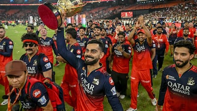 Royal Challengers Bengaluru's Virat Kohli, along with his teammates, takes a victory lap after winning the Indian Premier League title in Ahmedabad on Tuesday. AFP