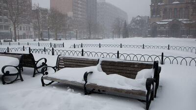 Snow covers the benches in Copley Square as the blizzard continues in Boston, Massachusetts. Kayana Szymczak/Getty Images/AFP