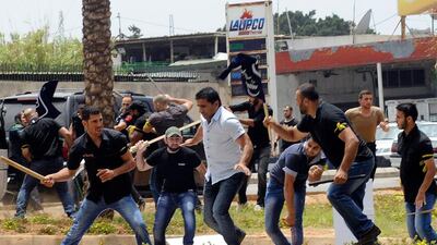 Hezbollah supporters clash with supporters of the Lebanese Option Party during a protest in front of the Iranian Embassy in Beirut, Lebanon. AP Photo