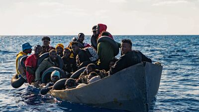 Migrants on a boat off the coast of Sicily, southern Italy. AFP