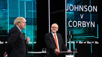 Britain's Prime Minister Boris Johnson (L) and Britain's Labour Party leader Jeremy Corbyn (R) as they debate on the set of "Johnson v Corbyn: The ITV Debate" in Salford, north-west England. AFP / ITV / Jonathan HORDLE