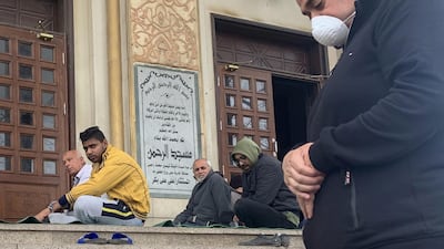 A man wearing a protective mask attends Friday prayers outside Abdel Rahman Mosque in the Cairo neighborhood Maadi, Reuters