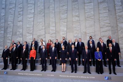 Nato Secretary General Jens Stoltenberg and defence ministers pose for an official photo after a meeting in Brussels. EPA