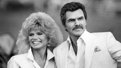 In this March 15, 1987 photo, Burt Reynolds and Loni Anderson appear at a polo match in Boca Raton, Florida. AP
