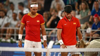 Spain's Rafael Nadal Carlos Alcaraz check a line call with chair umpire Miriam Bley. AFP
