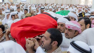 Sheikh Humaid bin Rashid, Ruler of Ajman, and Sheikh Ammar bin Humaid, the Crown Prince of Ajman, at the funeral for Abdullah Ali Hassan Al Hammadi, one of the 45 Emirati soldiers who died in Yemen on Friday. Wam