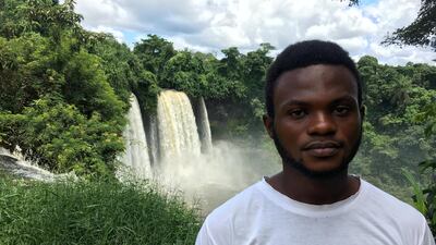 An English-speaking refugee from Cameroon stands near the Agbokim Waterfalls on the Nigerian border. Colin Freeman for The National