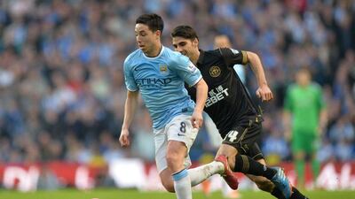 Samir Nasri and Manchester City travel to Barcelona looking to overcome a 2-0 deficit from the first leg. Paul Ellis / AFP