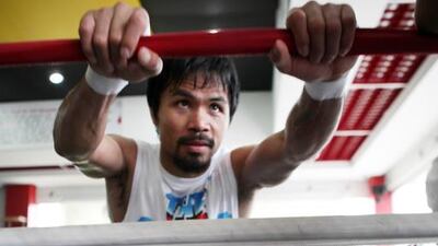 Manny Pacquiao takes part in a training session in General Santos, Philippines. Jeoffrey Maitem / Getty Images