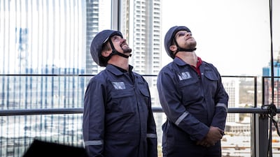Richard Hammond and project manager Pieter van der Walt after window cleaning the exterior of the Burj.