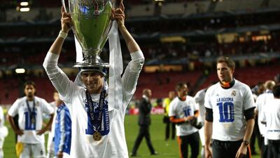Real Madrid's Gareth Bale lifts the Champions League trophy after his side won the final on Saturday night. Andres Kudacki / AP / May 24, 2014
