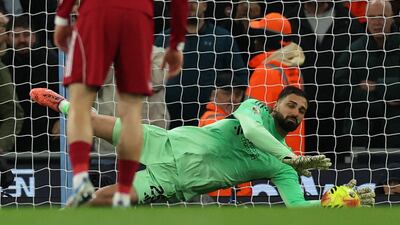 Liverpool goalkeeper Giorgi Mamardashvili saves Manchester City striker Erling Haaland's penalty. Reuters