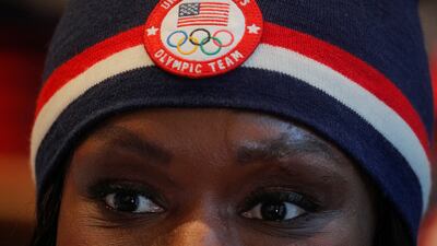 US Winter Olympic bobsledder Aja Evans shows off items designed for the US Winter Olympic Team at the company's store in New York City. Reuters