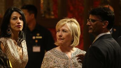 Former US Secretary of State Hillary Clinton waits for her car after attending the wedding ceremony. Reuters