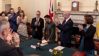 Ukraine's President Volodymyr Zelenskyy is applauded after addressing Britain's new Labour Cabinet, in London. Reuters