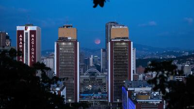 The blue supermoon, the second full moon of the month, is seen between the Simon Bolivar Center towers in Caracas. AFP