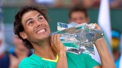 Rafael Nadal celebrates with his trophy after winning the BNP Paribas title at Indian Wells.