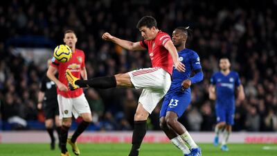 Harry Maguire of Manchester United clears under pressure from the Michy Batshuayi of Chelsea at Stamford Bridge in February. Getty Images