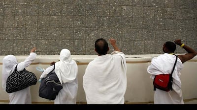 On the first day of Eid Al Adha, Muslims throw stones during the Jamarat, or stoning of Satan, ritual in Mina. Amr Abdallah Dalsh / Reuters