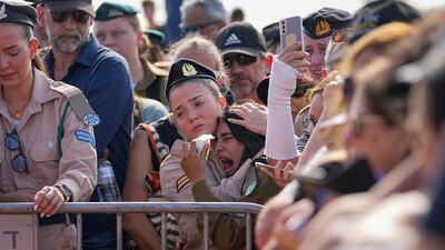 Mourners attend a funeral in Gan Yavne, Israel. AP