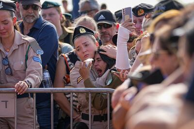 Mourners attend a funeral in Gan Yavne, Israel on October 17. AP