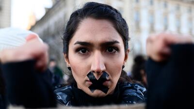 A protester in Turin, Italy expresses her solidarity with Iranian demonstrators after the death of Mahsa Amini in custody. Getty