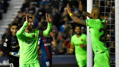 Lionel Messi celebrates after scoring a goal with Arturo Vidal. AFP