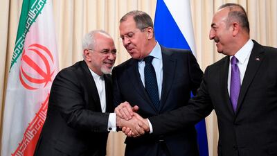 Russian Foreign Minister Sergei Lavrov with Iranian counterpart Mohammad Javad Zarif, left, and Turkish Foreign Minister Mevlut Cavusoglu; Russia's military and political gains in Syria have been significant. Alexander Nemenov / AFP