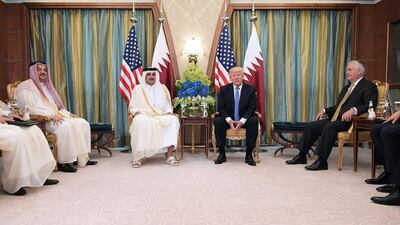 US president Donald Trump, centre right, and Qatar’s Emir Sheikh Tamim Bin Hamad Al-Thani, centre left, take part in a bilateral meeting at a hotel in Riyadh on May 21, 2017. Mandel Ngan / AFP